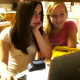 Two girls are surfing the Web, when one of them (the blonde on the right) blows a ripping fart and scares off her friend!